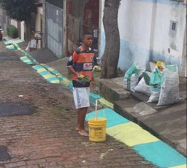 When Jesus was 17 he was snapped painting the streets of Sao Paulo