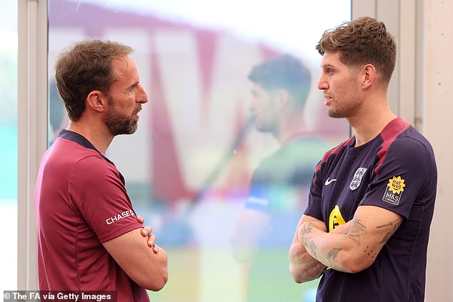 England boss Gareth Southgate was seen talking to defender Stones in the gym