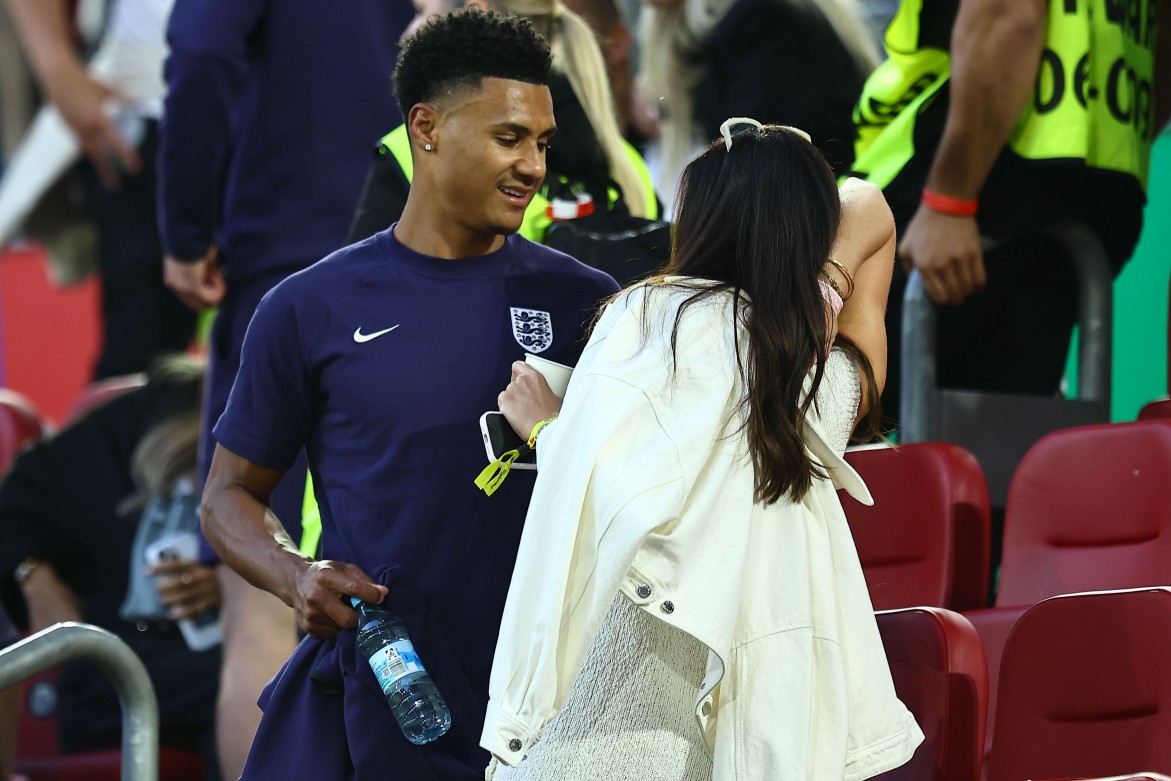 England star Ollie Watkins was all smiles after full-time with partner Ellie Anderson