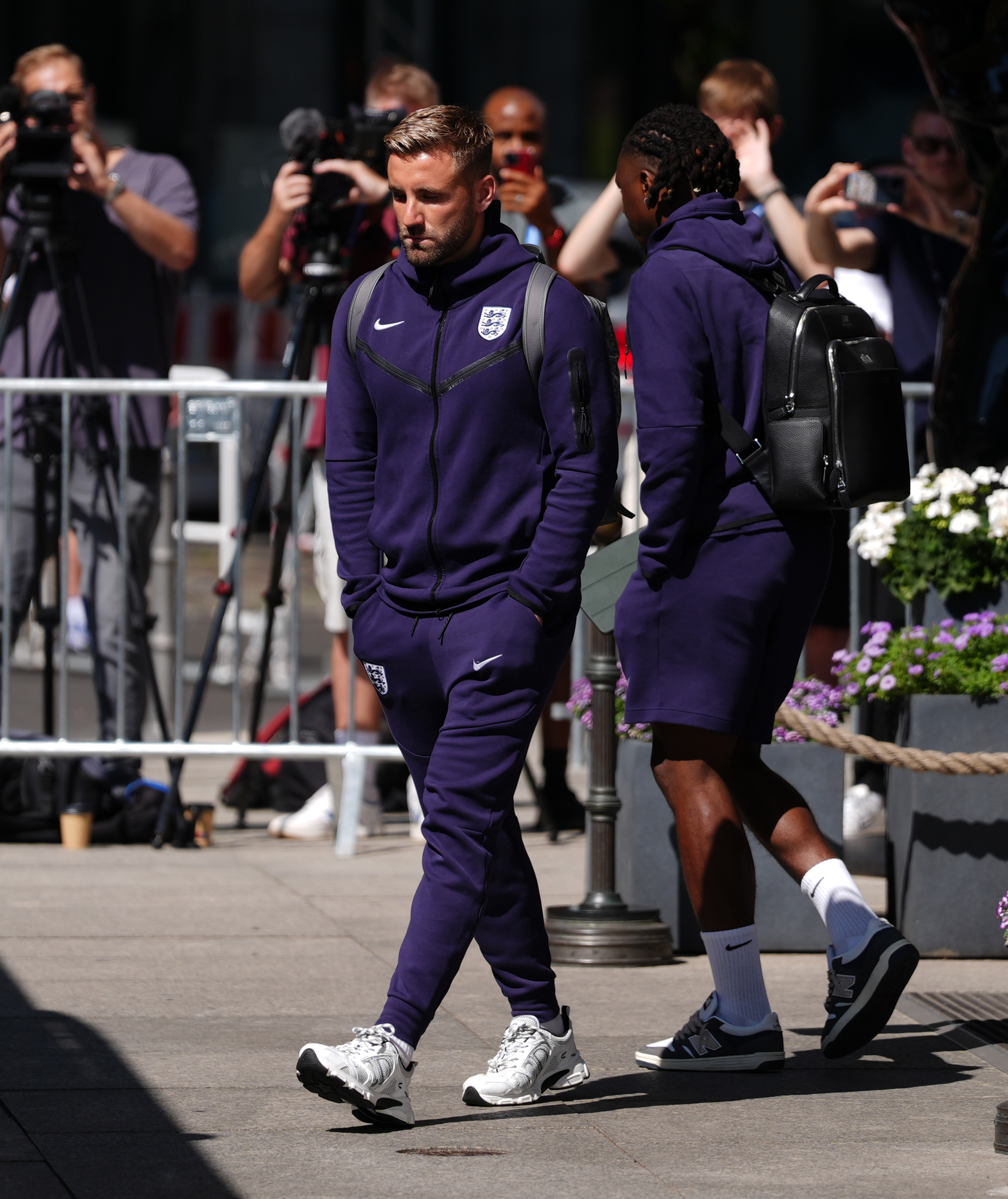 Shaw looked disappointed as he walked onto the bus