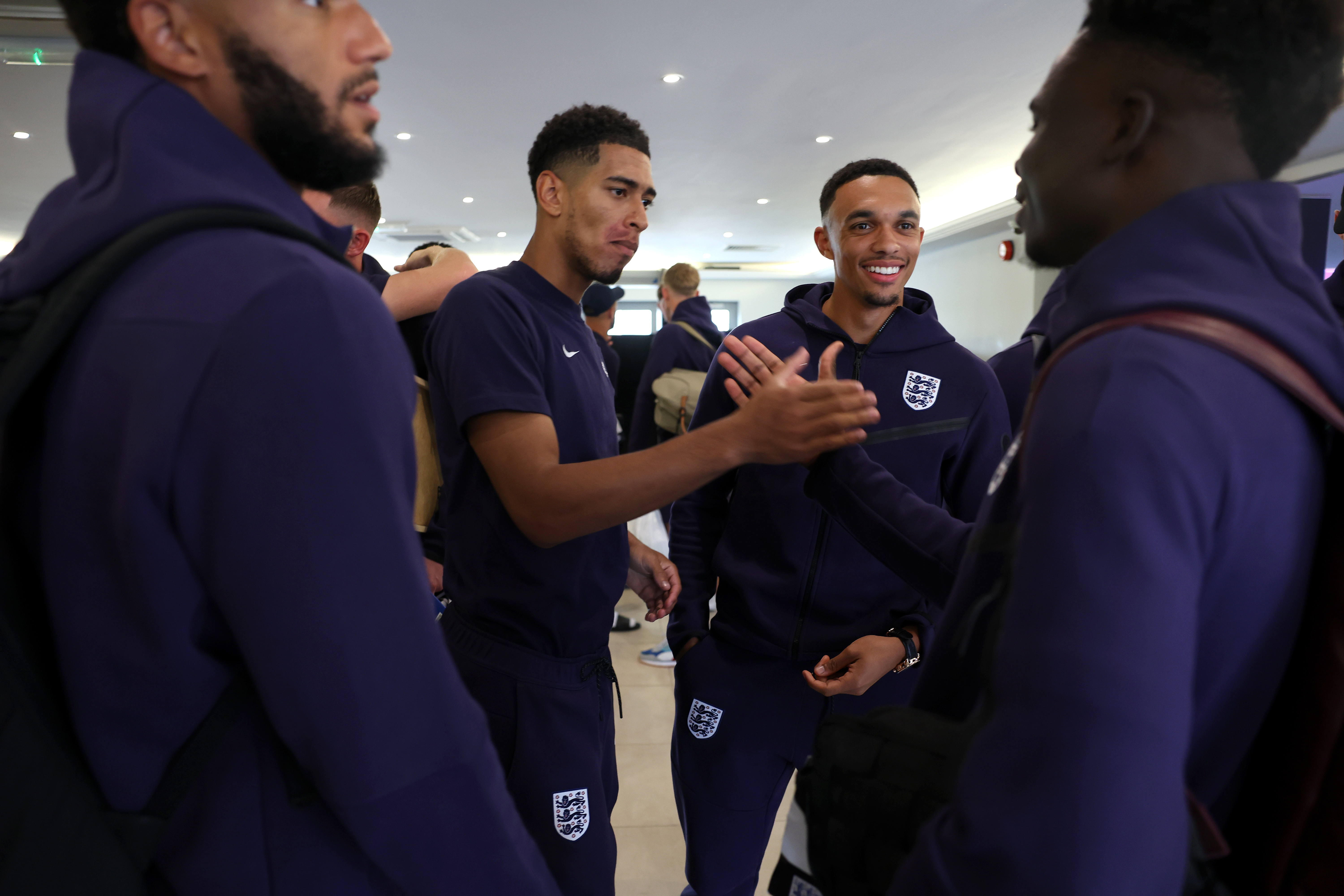 Joe Gomez, Jude Bellingham, Trent Alexander-Arnold and Bukayo Saka interact as the England squad go their separate ways