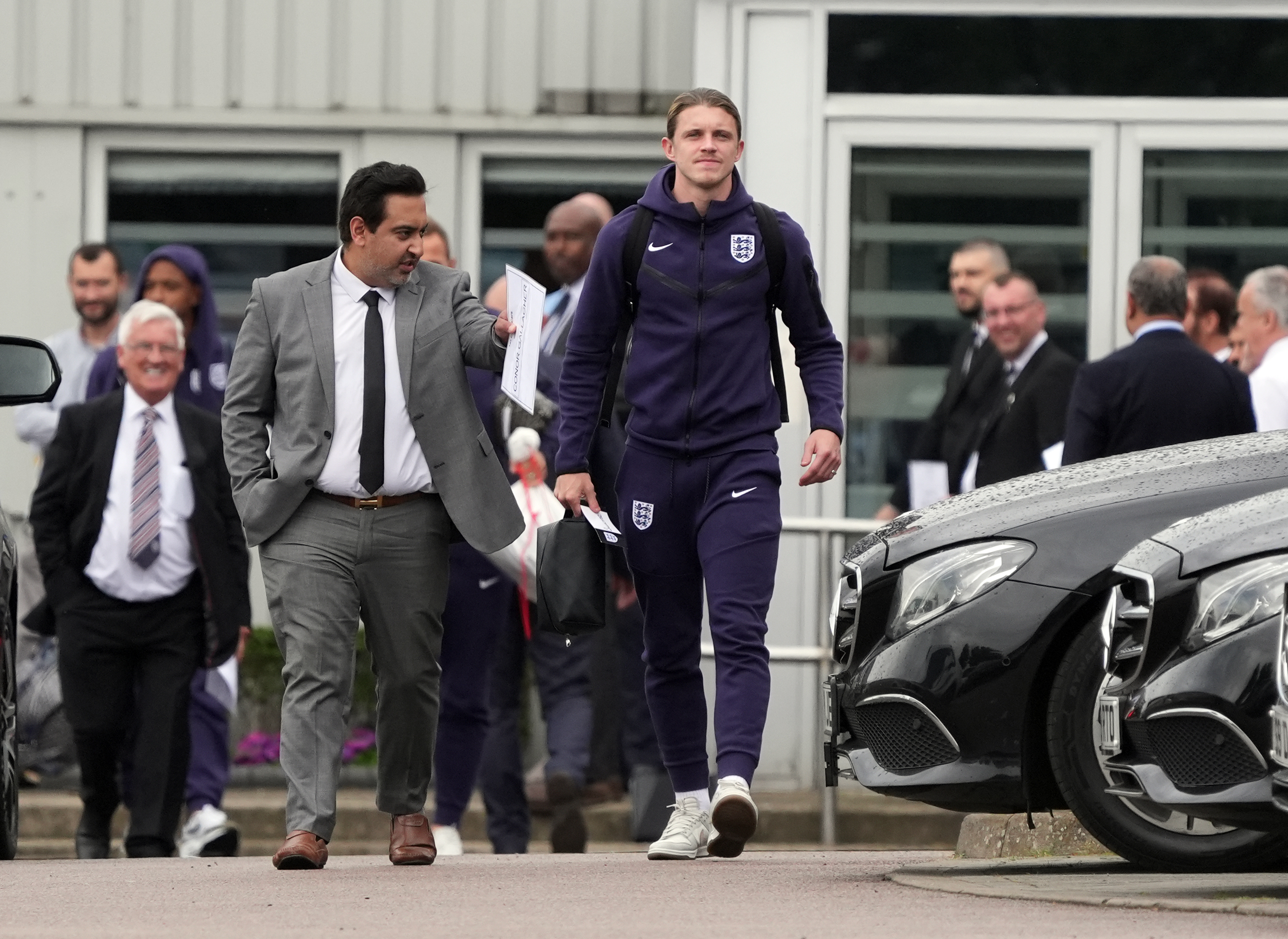 Conor Gallagher looked bleak as he was guided through Stansted earlier