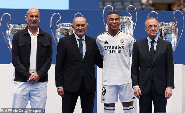 He also took a photo with Zinedine Zidane, club president Florentino Perez, and honorary president and club legend Jose Martinez Pirri (right)