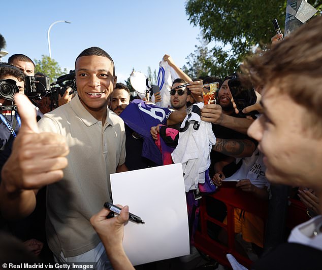 A throng of supporters greeted Mbappe outside the ground to try and get photos and autographs